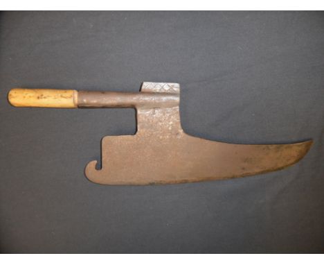 AN AXE, 18TH CENTURY formed of a goosewing-shaped blade stamped with a series of decorative stars, crescents and the initials