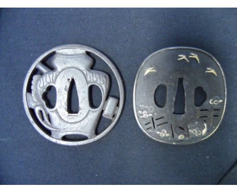TWO JAPANESE SWORD GUARDS (TSUBA) each of iron with kozuka hitsu-ana and kogai hitsu-ana, the first with shibu-ichi fukurin, 