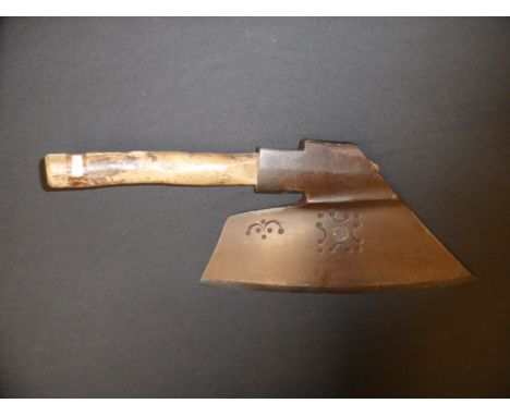 AN AXE, 18TH CENTURY formed of a slightly curved blade stamped with a series of decorative pellets, crescents and lines, rect