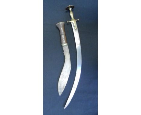 AN INDIAN SWORD (TALWAR) FOR A BOY AND A KUKRI KNIFE, 19TH AND 20TH CENTURIES the first with curved single-edged blade, coppe
