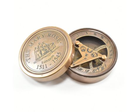 A contemporary brass cased compass and sundial. The lid of the case being inscribe 'The Mary Rose, London 1511-1545'. Weight 