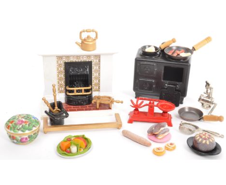 A collection of vintage retro assorted dolls house furniture and house hold goods of metal, wood and ceramic construction alo