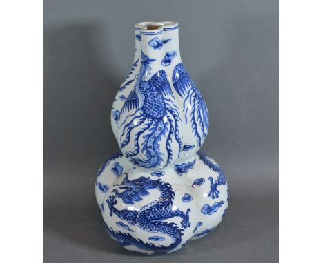 A 19th Century Chines porcelain Gourd vase of triform decorated in undeglaze blue with serpents, blue seal mark to base, 28cm