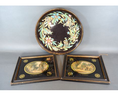 A Circular Enamel Tray decorated with flowers, 39cms diameter, together with two oval engravings 'The Burning Glass' and 'The