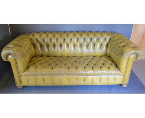 A button upholstered  leather Chesterfield sofa in green, 206cms long, 87cms deep and 74cms tall 