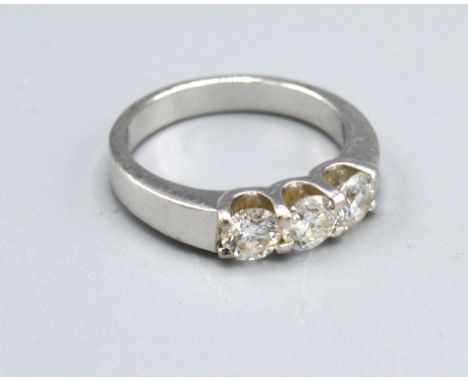 A White Metal Three Stone Diamond Ring, the three diamonds claw set, 5.6gms. ring size L 