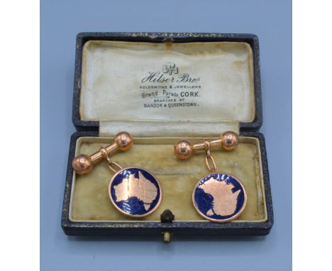 A pair of Austrian yellow metal and enamel set cufflinks 