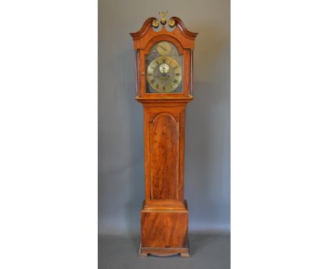 A George III mahogany longcase clock, the arched door with swan neck pediment above an arched door and ogee bracket feet, the