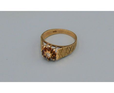 A 9ct gold dress ring set red and white stones, 2.9 grams, ring size N 