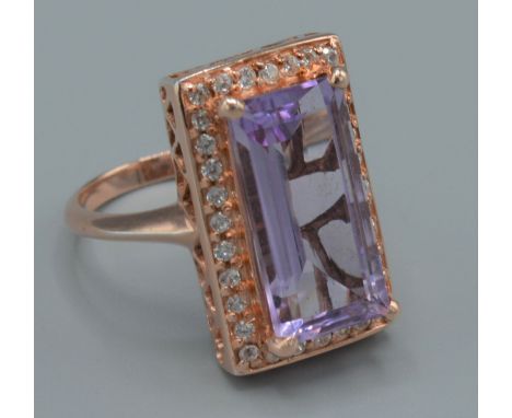 D Joy, A dress ring set with a large Amethyst, elongated octagon cut, ring size S 