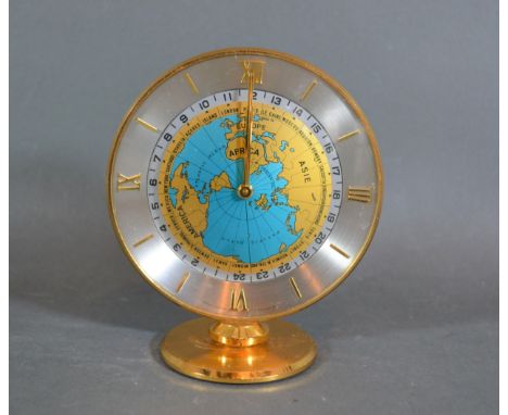 An Imhof Hours Of The World Time Clock, the circular dial within a brass case, 12cms tall 