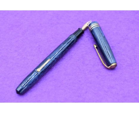 A Conway Stewart 36 fountain pen, lever fill, in pale and dark blue narrow straited pattern, one broad and two narrow bands t