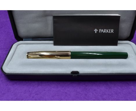 A boxed Parker Insignia fountain pen, jade green with gold cap
