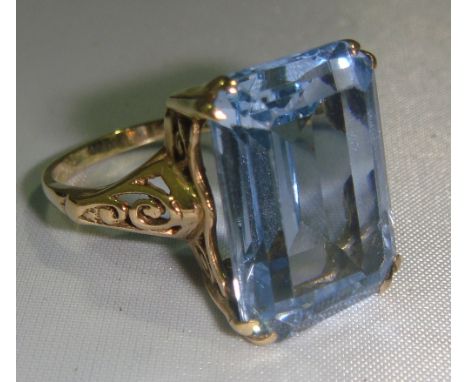 9 ct gold ring set with large claw set baguette topaz