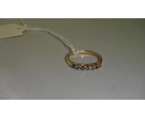 Ladies 9 ct gold ring set with 6 sapphires 