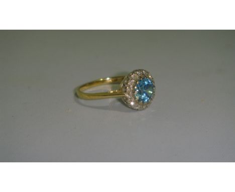 18 ct gold ring set with chip diamonds and an aquamarine