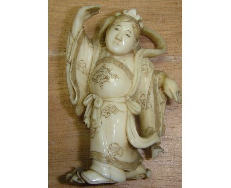 19th century Japanese netsuke made of carved ivory depicting a female dancer (some losses, yellowing and splitting) 6 cms x 3