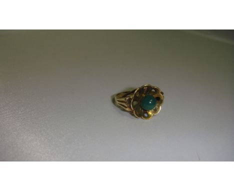 Unmarked gold metal ring stamped 333 set with single polished jade bead