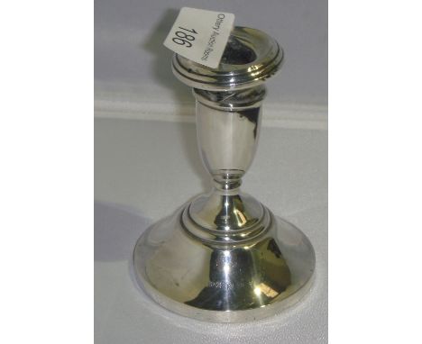 Filled silver candle stick of squat form Birm. 1921 11 cms x 7 cms