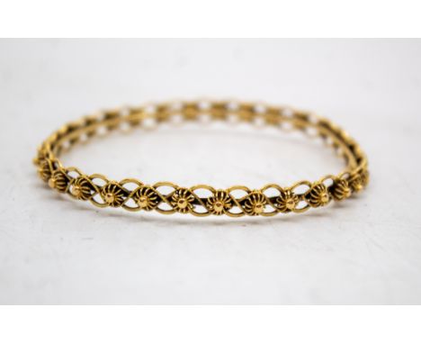 21ct Gold Openwork Bangle The Bangle is hallmarked "21C" for 21ct Gold. Total Gross Weight of the Bangle is approx. 13.7 gram