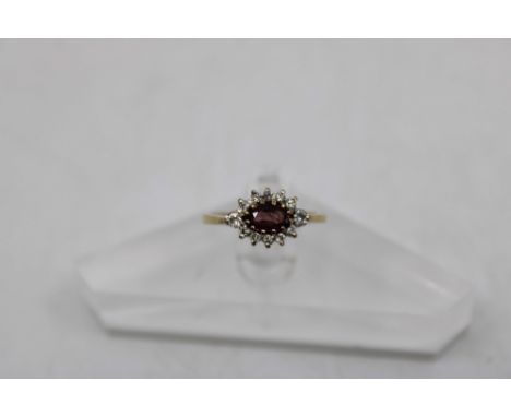 9ct Gold Ruby and Diamond Dress Ring The Ring consists of an Oval Brilliant Cut Ruby that measures approx. 4mm x 6mm.  The Ri
