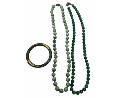 Two Chinese green Jade / Hardstone necklaces with Silver and gilt metal clasps and a Jade / Hardstone bracelet with gilt meta
