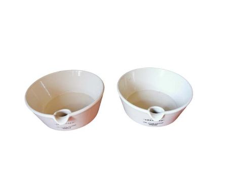 Two vintage white glazed spouted dairy bowls 'The Creamsep' The Churn Company Hailsham England, each 27cm in diameter. (1 af)