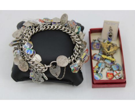 Sterling Silver Charm Bracelet with Silver Enamel Travel Charms and other Charms On each link of the bracelet there is a Lion