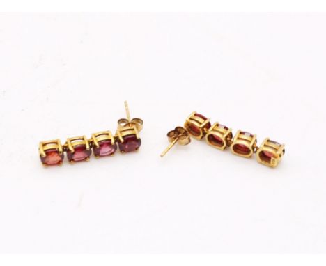 9ct Gold Ruby Droplet Earrings  Each Earring consists of four Oval Brilliant Cut Rubies that each measure approx. 5mm-6mm x 4