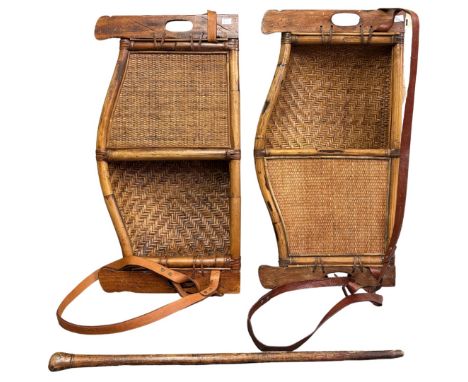 A pair of strawwork grape hods with leather carrying straps, early 20th century, 77 x 39cm and a donkey stick of tapering for