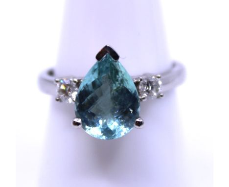 Platinum Paraiba Tourmaline and Diamond Ring  The ring consists of a Pear Shaped Mixed Cut Pale Greenish Blue Paraiba that me