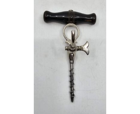 A 19th century English two piece "Holborn" Champagne Tap with ebonised wood handle.  Marked with "Holborn Champagne Screw". T