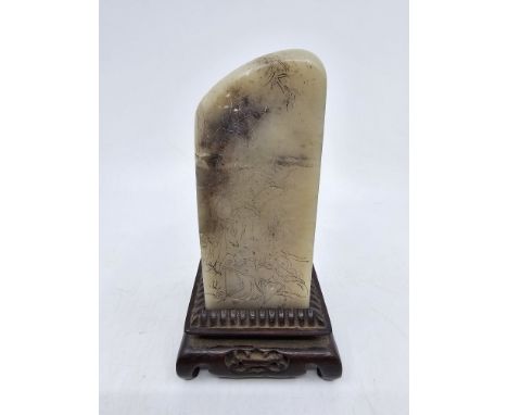 A Chinese soapstone scholars seal, with hardwood stand. Finely engraved to each side with images of ladies taking part in dif