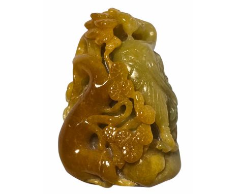 A fine Yellow Jade carved pebble.  The stone carved as a crane grasping a lingzhi next to a pine tree. A large lingzhi carved