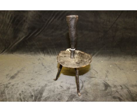 A 17th/18th wrought iron tripod rushlight candlestick, 21cm high