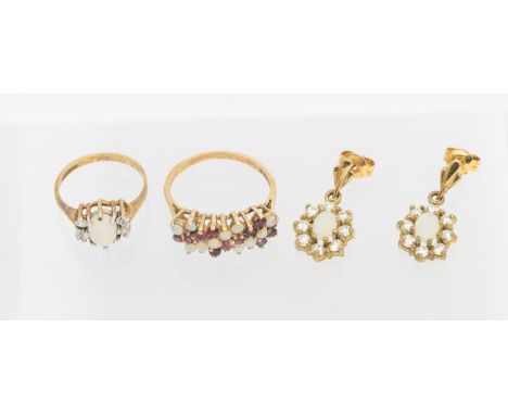 A selection of 9ct Gold Opal Jewellery.  To include a 9ct Gold Opal and Diamond Ring, a 9ct Gold Opal and Ruby Ring and a pai