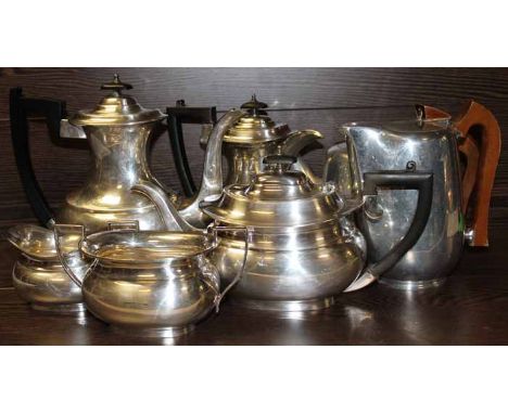 SILVER PLATED FIVE PIECE TEA SERVICE
of rectangular form; together with a Picquot hot water pot and teapot, coffee pot 22cm