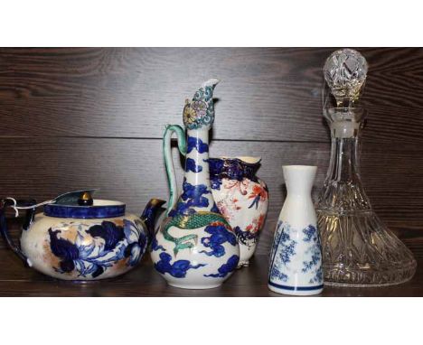 POSSIL POTTERY TEAPOT
painted with blue flowers and on a cream ground, with gilt highlights, 21.5cm long; together with a mod