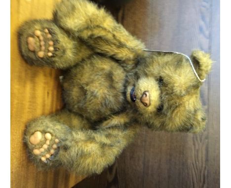 FUR REAL MECHANICAL BEAR with purple stitched 'FR' patch, approximately 22cm high Good condition