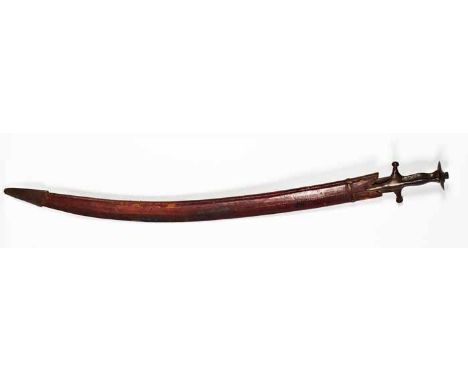 INDIAN TULWAR SWORD
circa 1900, in a burgundy leather scabbard, 98cm long