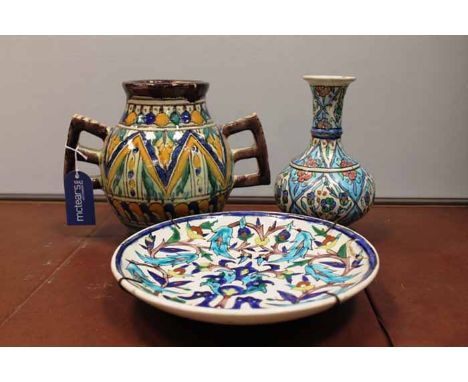 NORTH AFRICAN CERAMIC VASE 
twin handled and of baluster body, in yellow, green and blue geometric patterning, 19cm high; alo