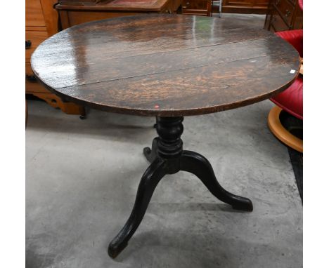 An antique provincial oak circular occasional table on tripod base, 85 cm diam x 75 cm high 