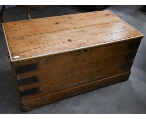 A small waxed pine iron bound trunk, 75 cm wide x 40 cm deep x 76 cm high 