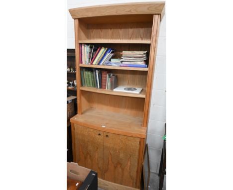 A light ash and chevron strung bookcase in the Art Deco style by repute - Peake &amp; O'Dwyer, with three open shelves over t