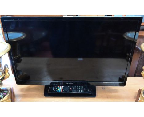 Hitachi 24HEV200UA television with integrated DVD player, 24" screen c/w remote control 