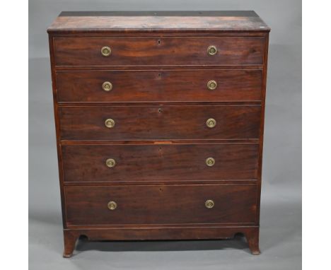 A Victorian mahogany country house chest of five long graduated drawers with brass back-plate and ring handles, raised on sha