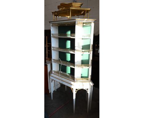 A pair of bespoke white, green and gilt painted free standing display stands in the Chinese Chippendale manner, illuminating 