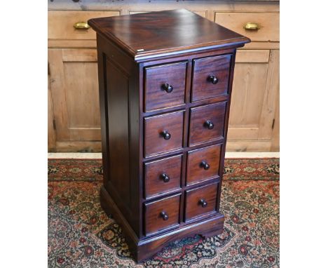 A dark hardwood chest of eight drawers on shaped bracket feet, 50 x 50 x 100 cm h 