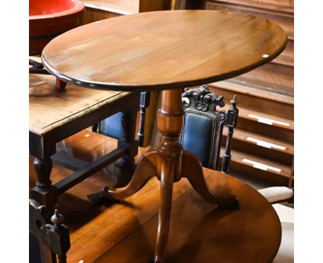 An oval oak tripod breakfast table, 112 cm x 77 cm x 76 cm h with 4 Windsor armchairs 