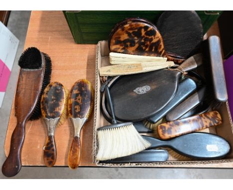 Various tortoiseshell and ebony brushes and mirrors, bone and embroidered silk fan, mother of pearl coin purses etc 